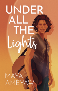 A young man is standing with a guitar over his shoulder looking out at the reader on this book cover for Under All the Lights.